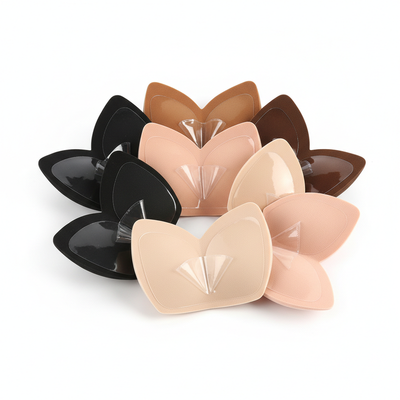 V-shaped adhesive bra inserts in multiple skin tones on white background